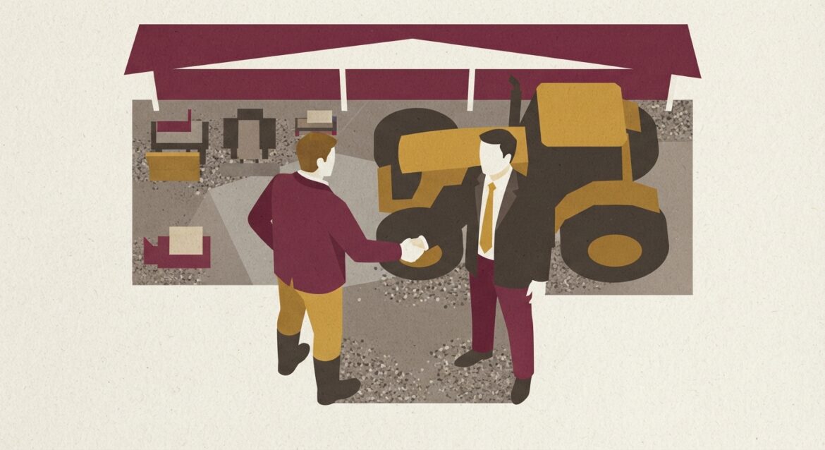 A farmer shaking hands with a local banker in front of a tractor at an equipment dealership
