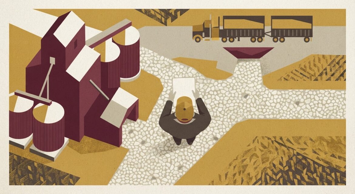 A grain elevator and storage bins with a farmer holding a contract paper, harvest truck in background